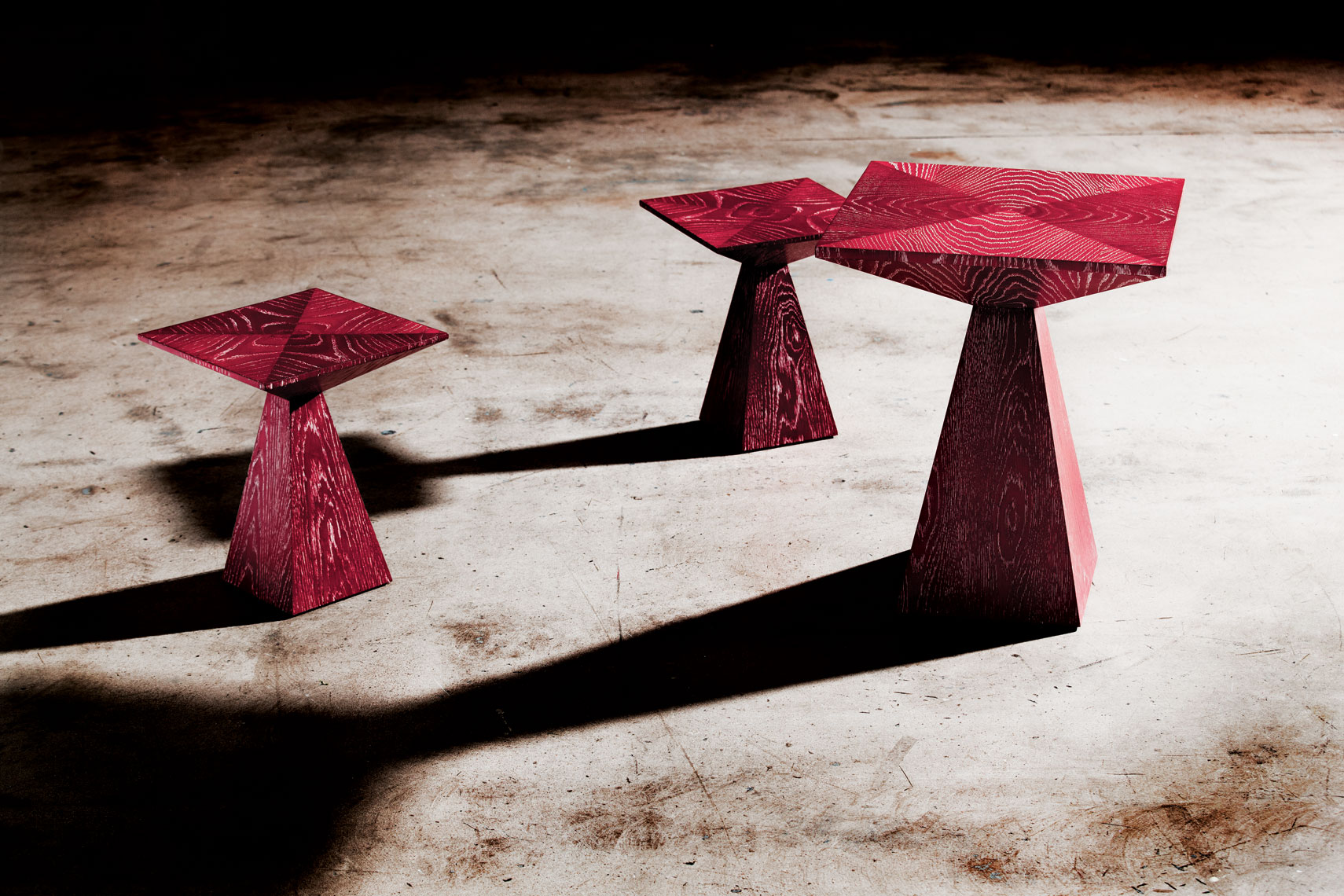 Red tables on concrete